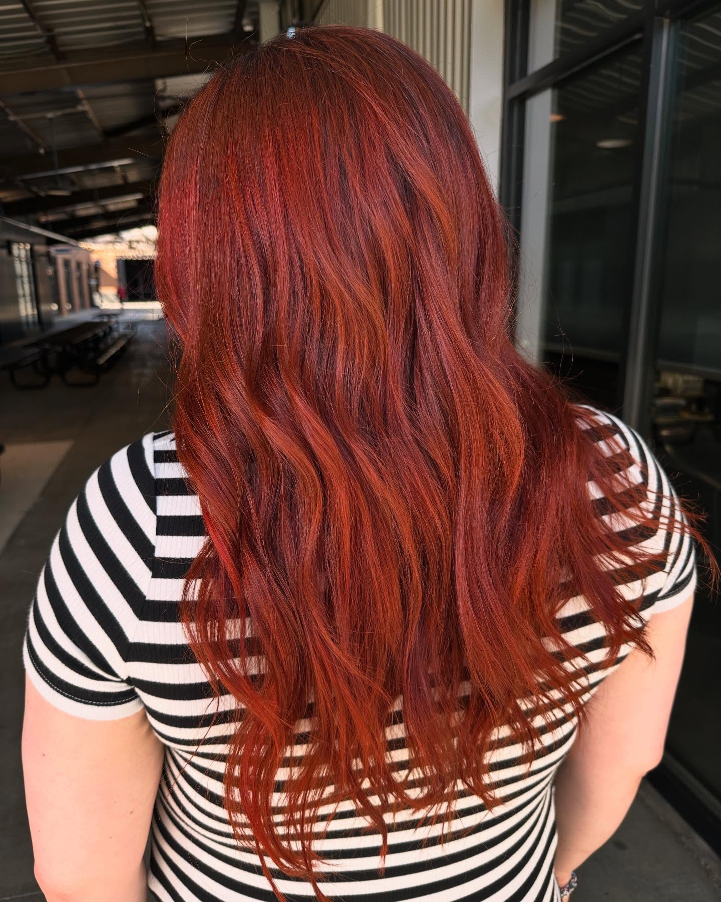 Long vivid red hair color by Madison Richardson