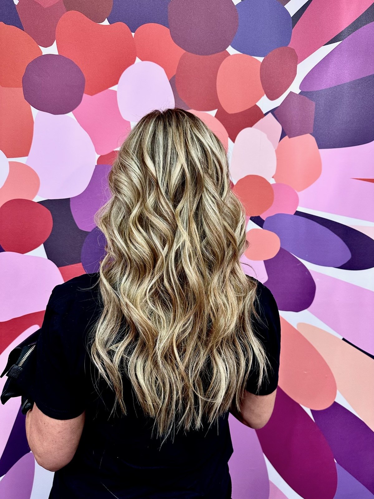 Long dimensional blonde extensions by Dakota Coone
