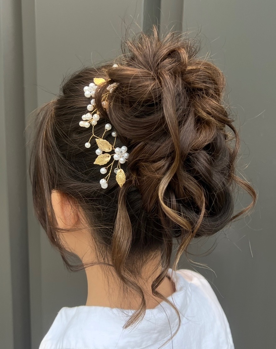 Formal updo with pearl and gold hair accessory by Emilee Anderson